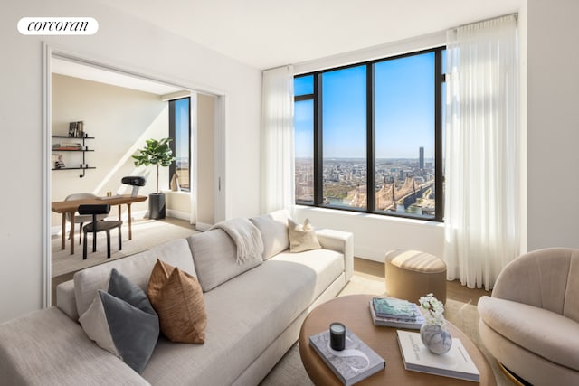 living area featuring a view of city and visible vents