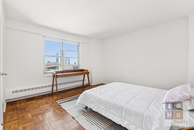 bedroom featuring baseboard heating