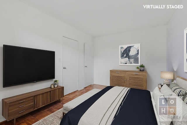 bedroom featuring parquet floors