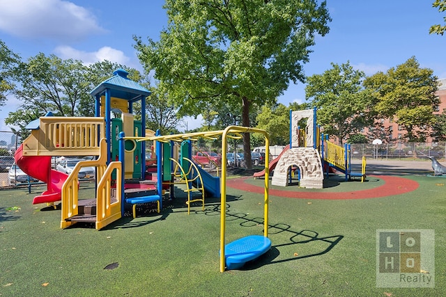 communal playground featuring fence