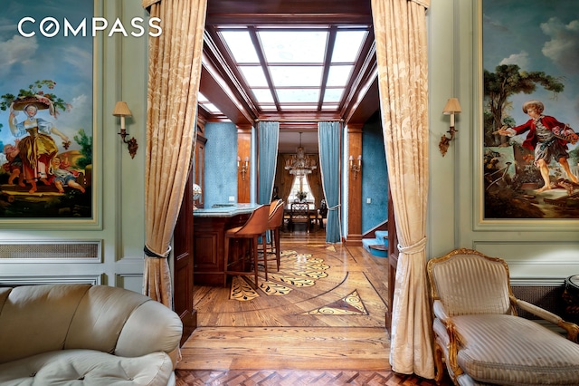 interior space featuring an inviting chandelier and light wood finished floors