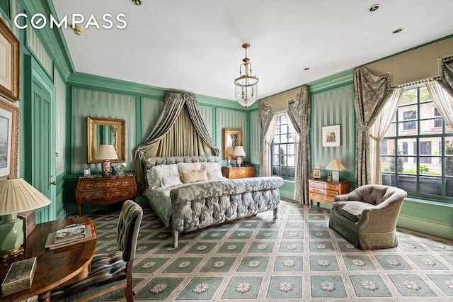 bedroom featuring a decorative wall