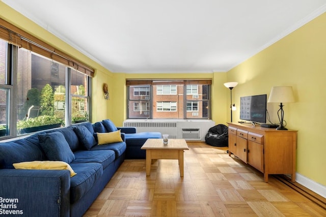 420 E 55th St Unit 11M, New York City, NY 10022 - living area featuring radiator heating unit, ornamental molding, baseboards, and a wall mounted air conditioner