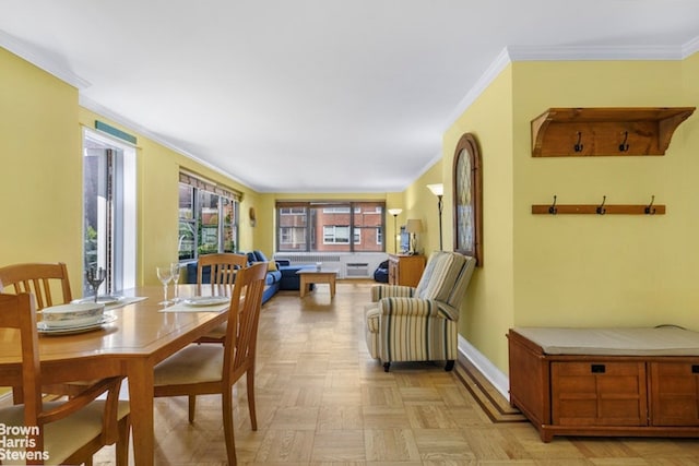 420 E 55th St Unit 11M, New York City, NY 10022 - dining space with baseboards and crown molding