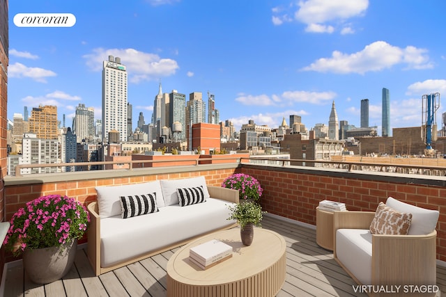 wooden deck with a city view and an outdoor hangout area