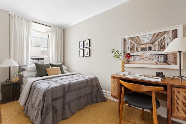 bedroom with baseboards and ornamental molding