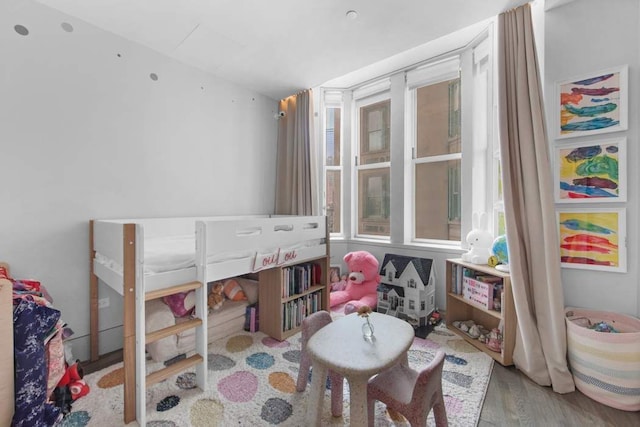 bedroom with light wood-type flooring