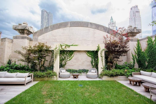 view of yard with a view of city and an outdoor living space