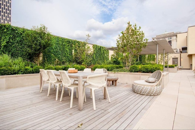 wooden deck with outdoor dining space