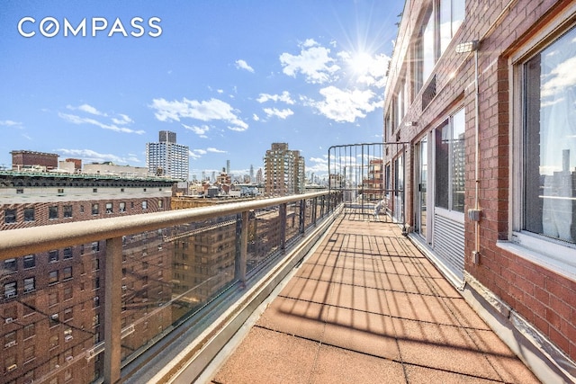 balcony featuring a city view