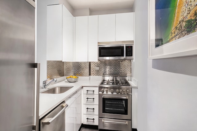 7 E 14th St Unit 1625, New York City, NY 10003 - kitchen featuring stainless steel appliances, light countertops, and white cabinetry