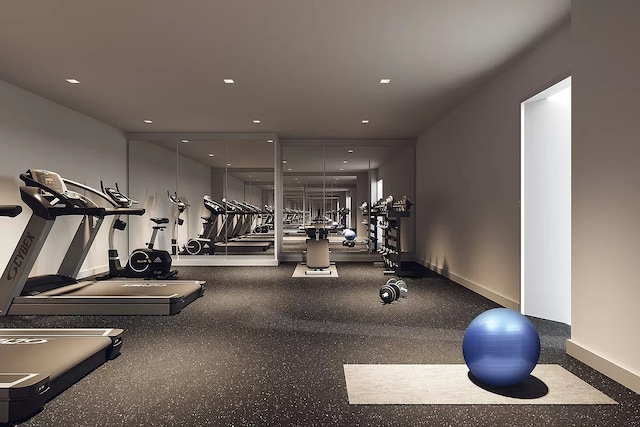 gym featuring recessed lighting and baseboards