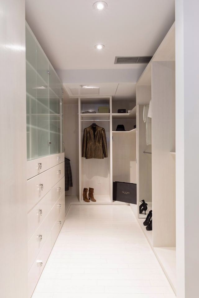 spacious closet featuring visible vents