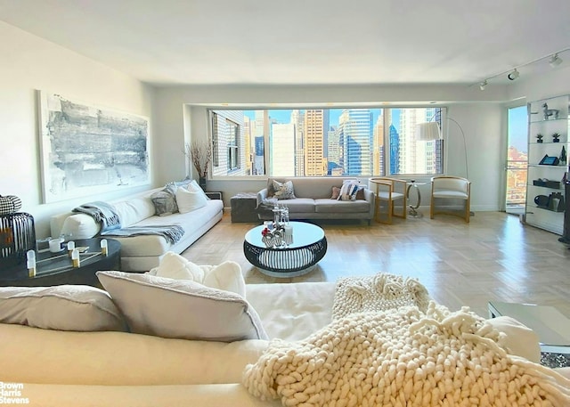 303 E 57th St Unit 32C, New York City, NY 10022 - living area featuring plenty of natural light and rail lighting