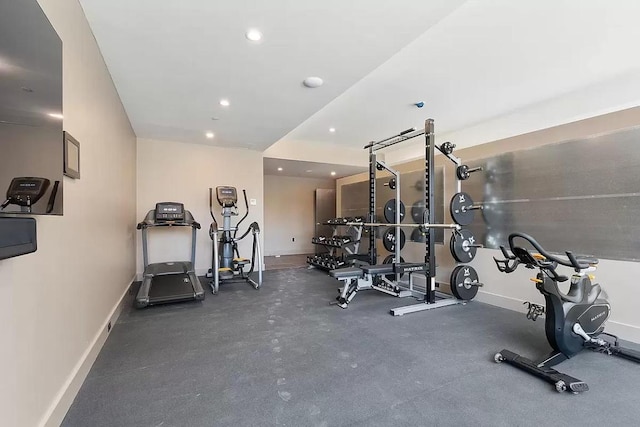 exercise area featuring recessed lighting and baseboards