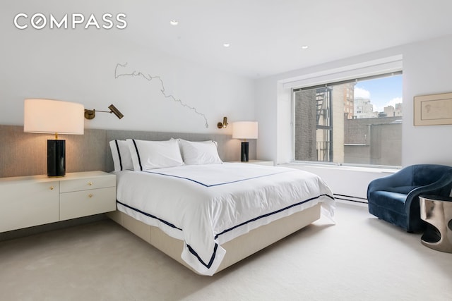 bedroom featuring recessed lighting and light colored carpet