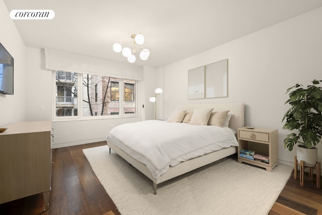 bedroom with a chandelier, dark wood-style flooring, and visible vents