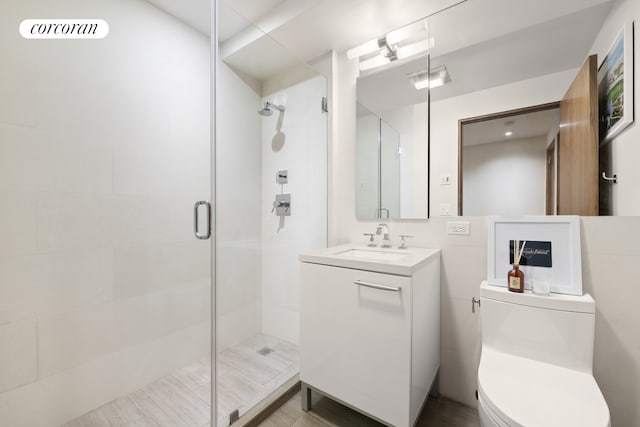 full bathroom with vanity, toilet, visible vents, and a stall shower