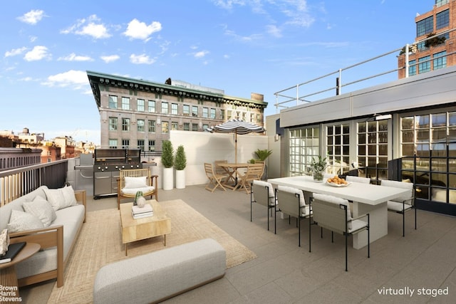 view of patio with outdoor lounge area, area for grilling, and outdoor dining space