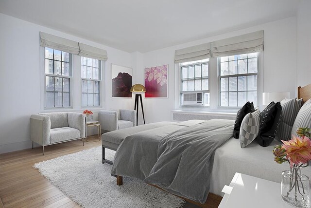 21 E 66th St Unit 4-E, New York City, NY 10065 - bedroom featuring baseboards, wood finished floors, and cooling unit