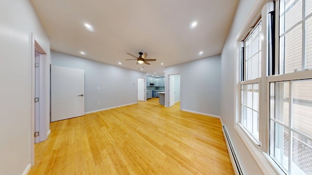 unfurnished living room featuring recessed lighting, light wood-type flooring, baseboards, and ceiling fan