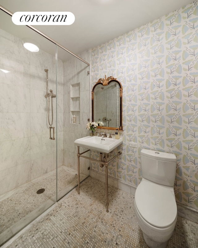 180 E 93rd St Unit 2, New York City, NY 10128 - bathroom with tiled shower, toilet, tile patterned floors, and baseboards