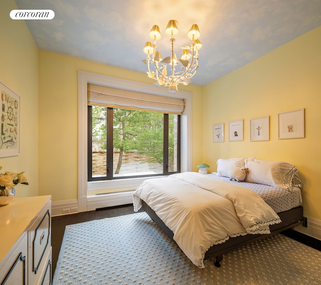 180 E 93rd St Unit 2, New York City, NY 10128 - bedroom featuring a chandelier, baseboards, and dark wood-style flooring