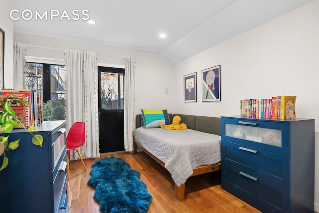 bedroom featuring recessed lighting, light wood-style flooring, and lofted ceiling