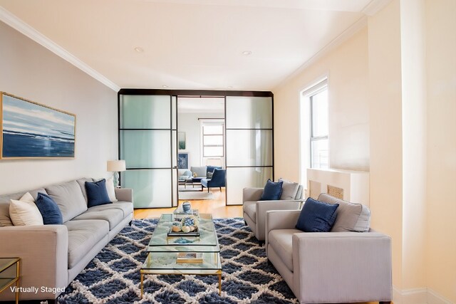 24 Bennett Ave Unit 41A, New York City, NY 10033 - living room featuring crown molding and wood finished floors
