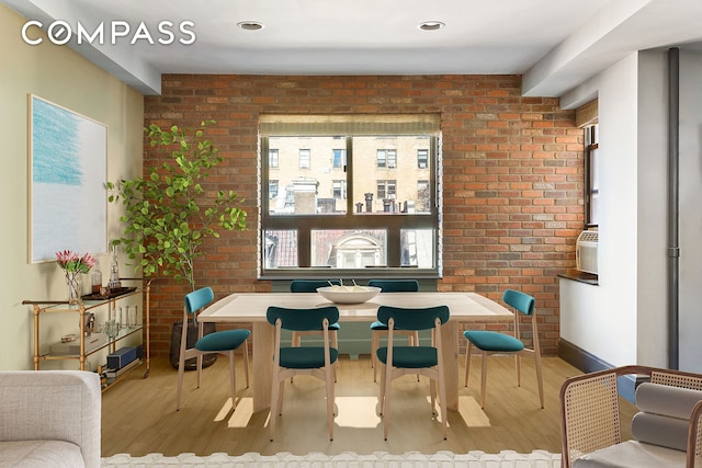 316 W 84th St Unit 6B, New York City, NY 10024 - dining space featuring wood finished floors and brick wall