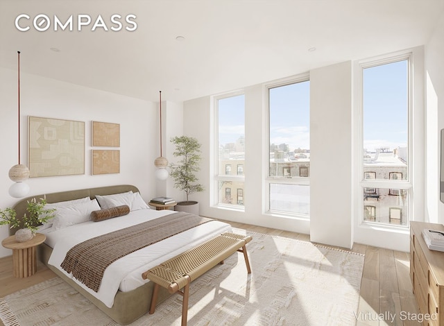 bedroom featuring light wood-style flooring