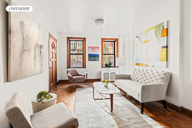 sitting room featuring visible vents and baseboards