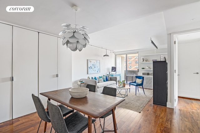 dining room with wood-type flooring and visible vents