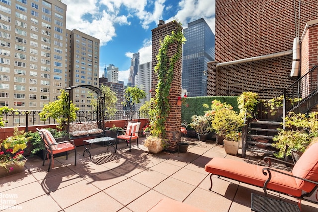 view of patio with a view of city and outdoor lounge area