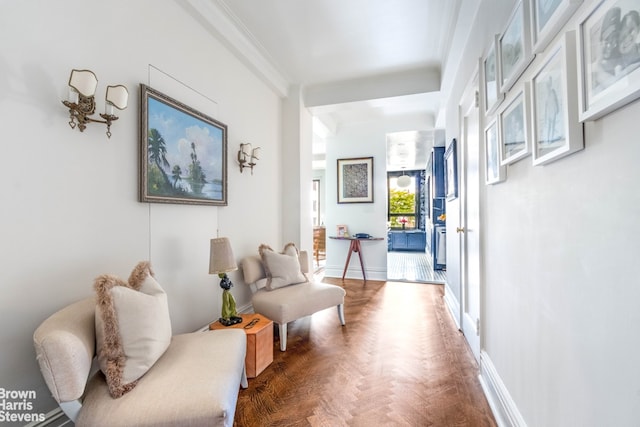 corridor featuring crown molding and baseboards