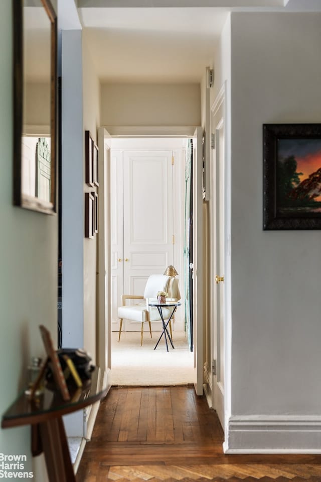 hall with dark wood-style floors