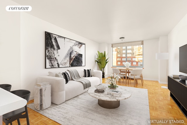 living room with visible vents and baseboards