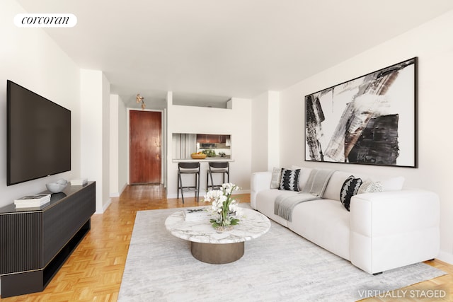 living area featuring visible vents and baseboards