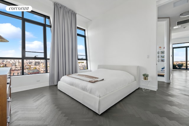 bedroom with visible vents and baseboards