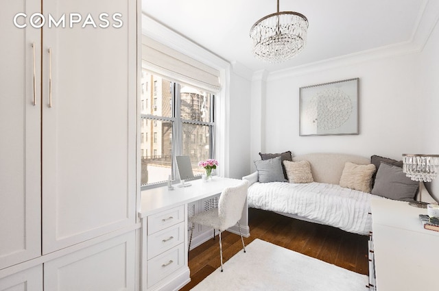 bedroom featuring dark wood-style floors, a chandelier, and crown molding