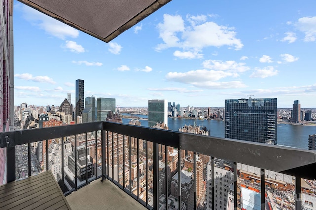 balcony with a view of city and a water view