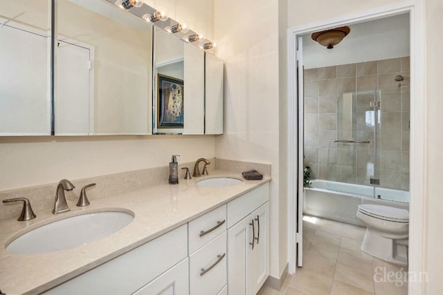 full bath with tile patterned flooring, a sink, bathing tub / shower combination, and double vanity