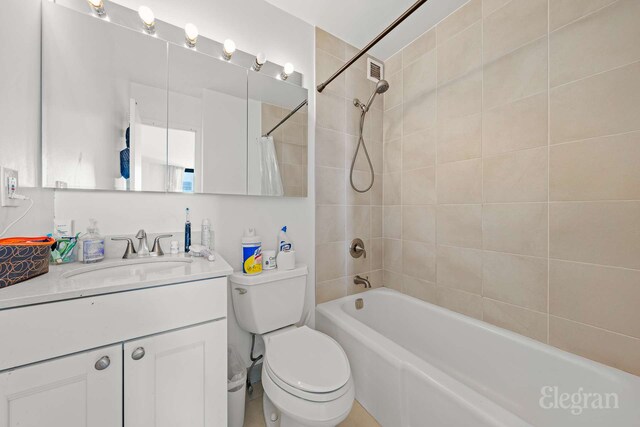 full bath featuring vanity, toilet, shower / bathtub combination with curtain, and visible vents