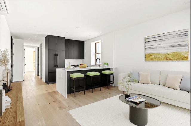 living room featuring light wood-style floors and recessed lighting