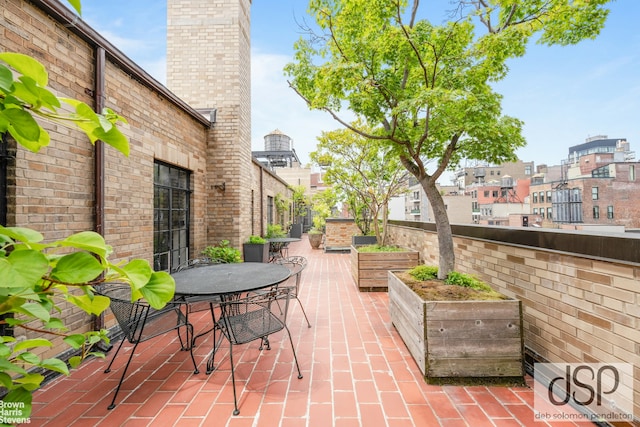 view of patio featuring outdoor dining area