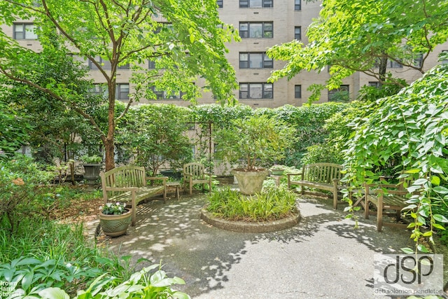 surrounding community featuring a patio