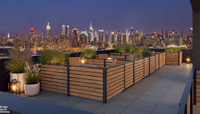 patio at night with a view of city lights
