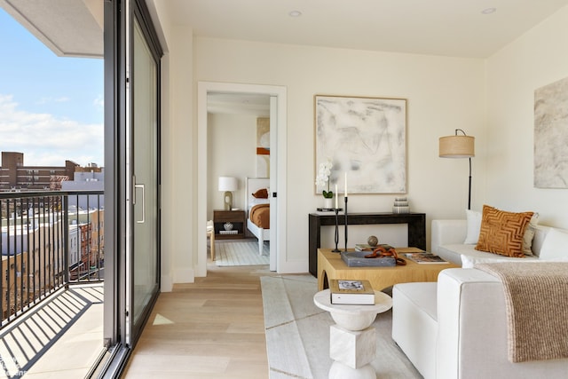 sitting room with light wood-style floors and baseboards