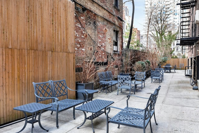 view of patio / terrace featuring fence