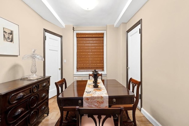 dining room featuring baseboards